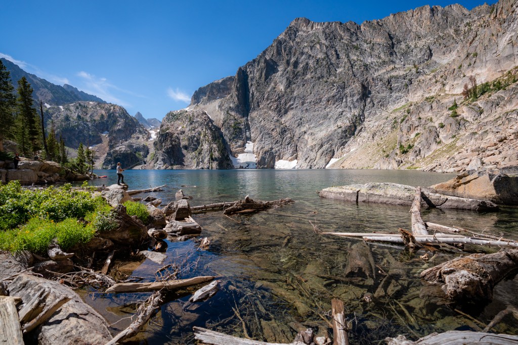 Woman fishing at Goat Lake in the Sawtooths near Stanley Idaho. Earth to Sarah Photos image. 