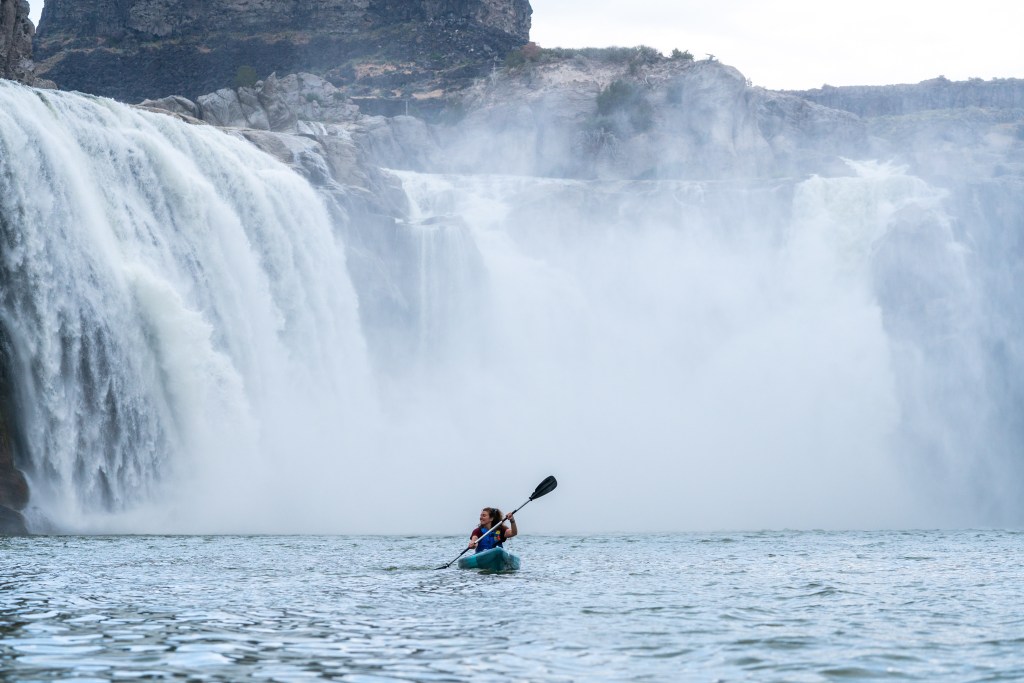 Girl kayaking below Shoshone Falls 