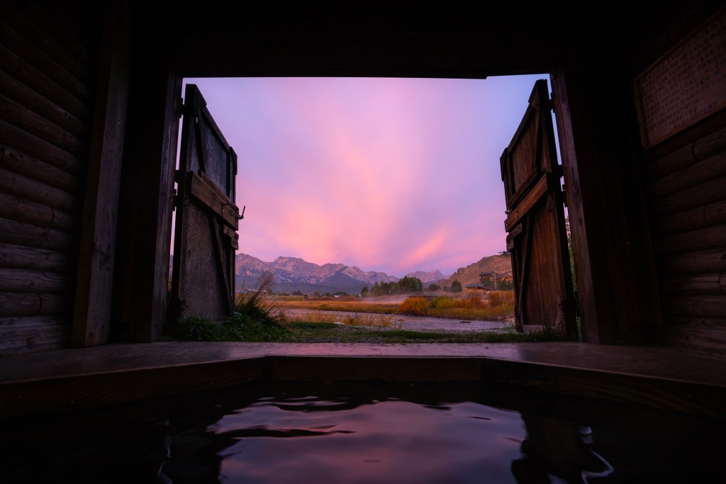 Mountain Village Hot Spring at Sunrise in Stanley Idaho looking at the Sawtooth Mountains
